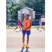 Young man in orange looking down at the court