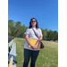A woman holding a clipboard.