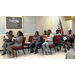 A group of people sit and support the scholarship winners.