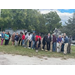 People using the shovels they are holding.