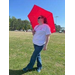 A woman standing under an umbrella.