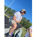 A man sitting on the bleachers.