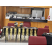 A decorated table with graduation decorations and streamers along the sides. 