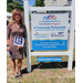 Realtor Alexis Davis with Coldwell Banker Sea Coast Advantage standing next to the NRP sign.