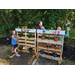 Kids atanding around the wooden structure called the Kids Zone.