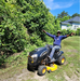 A man having fun on a riding mower.