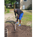 A gentleman raking.