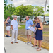 People conversing at the ribbon cutting ceremony.