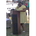 Woman speaking at a podium.