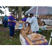 Volunteers making up the snack bags with hotdogs and chips.