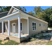 Porch, windows, front and side doors of third house in revitalization program.