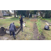 Individuals tending to a garden.