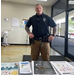 An officer standing with his hands on his hips.