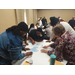 A table full of people doing an exercise with each other at the staff retreat.