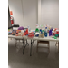 A couple tables with prizes and snacks at the Bingo event.