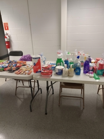 A couple tables with prizes and snacks at the Bingo event.